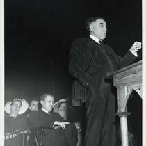 Abba Hillel Silver standing at a podium with people sitting behind him, circa 1950s