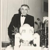 Abba Hillel Silver, standing behind a cake in shape of The Temple-Tifereth Israel, circa 1950s