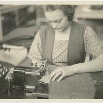 Woman sewing at the Joseph & Feiss Co. plant